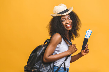Travel, tourism and vacation concept - happy young african american black woman with air tickets...