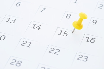 mark the event day with a pin. Thumbtack in calendar concept for busy timeline organize schedule,appointment reminder. planning business meeting or travel holiday planning concept. soft focus