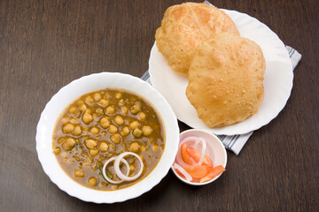 Channa Masala with Puri or Kabuli Chana with bhutara or spicy Chole, Indian Food