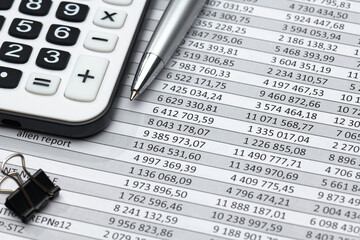 business office desk closeup - financial reports, analysis and accounting, set of documents, tables and graphs, various items for bookkeeping, calculator