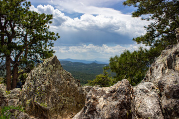 rock in the mountains, Mountains with Clouds above, Scenic Mountain Setting with Clouds