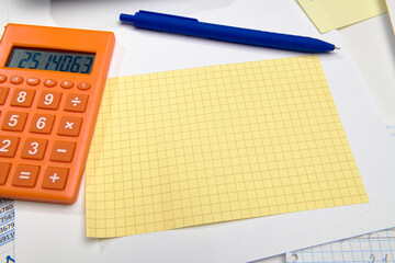 business office desk closeup - financial reports, analysis and accounting, set of documents, tables and graphs, various items for bookkeeping, calculator
