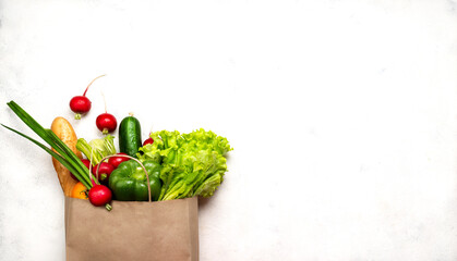 Paper bag full different healthy food products. Top view with place for text.