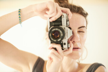 beautiful young girl and film camera