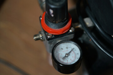 Air pressure reducer, dirty worker in dust. Air compressor detail