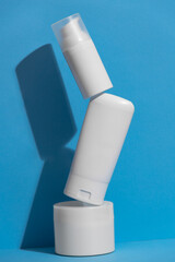 Set of blank white skincare cosmetic products on background with free space for advertising text.