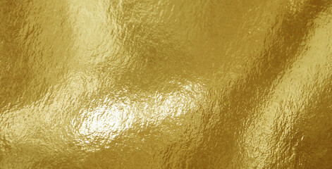 Fototapeta premium Gold foil texture background with highlights and uneven surface