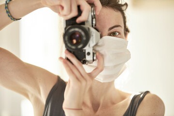 coronavirus mask and a female photographer