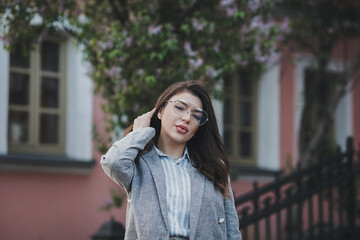 Fototapeta premium Stylish woman posing on the street