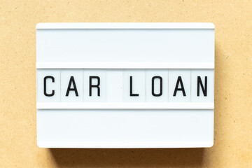 Lightbox with word car loan on wood background
