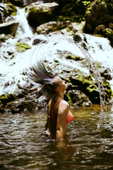 Summer hair flip at a waterfall