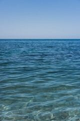 Obraz premium Clear sea water, and rocks on the bottom. Black sea with blue and emerald green water.