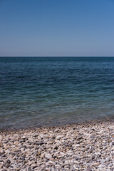 Obraz premium Clear blue-blue sea with a rocky shore. Black sea coast.