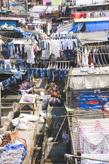 Fototapeta na wymiar Dhobi Ghat (Mahalaxmi Dhobi Ghat) is a biggest open air laundry in Mumbai, This place is one of famous landmark and tourist attraction of Mumbai, Maharastra, India.