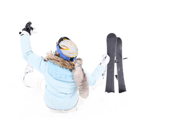 Woman siting on snow and makes selfie from go pro   with ski blades on mountain in forest in winter time