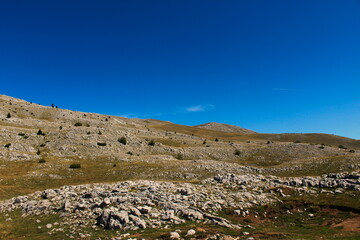 Fototapeta na wymiar Rocky landscape, karst on the mountain Bjelasnicni, Bosnia and Herzegovina.