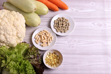 farm fresh vegetables and medical pills as a concept of comparison in healthy diet and vitamin supplies