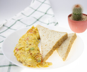 breakfast with scrambled eggs, toasts white with background.