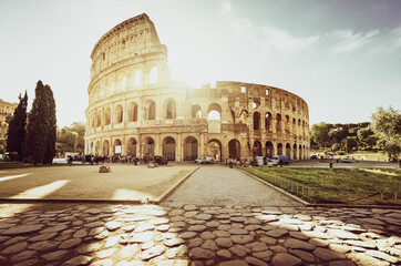 Fototapeta na wymiar Colosseum in Rome and morning sun, Italy
