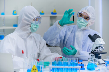 Scientist team has researching Coronavirus cure in the laboratory. Asian Doctor working on vaccine...