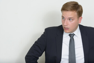 Portrait of businessman with blond hair wearing suit