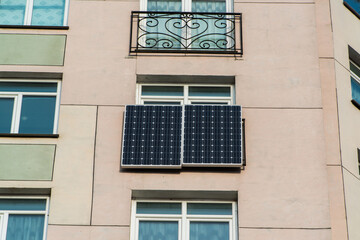 Fototapeta na wymiar Solar panels on a apartment window.