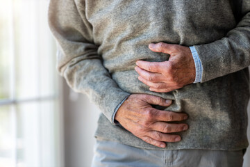 Senior man with stomach pain
