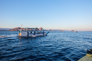 June 14, 2018 - Labuan Bajo : Tourists standing on a 3-hour boat trip to Komodo Island during sunrise