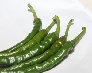 Spicy chili. Astrakhan pepper on a white background. To give taste, sharpness and piquancy to the prepared dish. The ingredient from the recipe