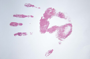 Purple handprint, silhouette of hand paint on a white background