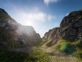 The sun rises over a path through a mountain landscape. Nature, adventure or exploration concept background.