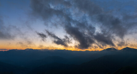Fototapeta premium Silhouette Maritime Alps mountain range against sky at sunset, South France