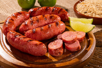 Grilled sausage. Grilled Sausage on wooden board. Brazilian barbecue.