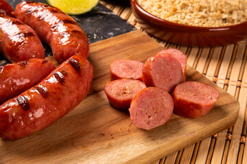 Grilled sausage. Grilled Sausage on wooden board. Brazilian barbecue.