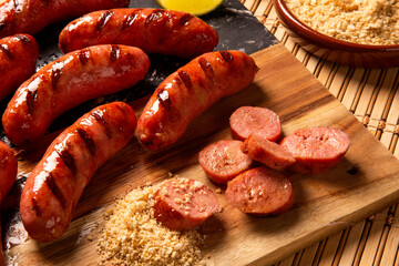 Grilled sausage. Grilled Sausage on wooden board. Brazilian barbecue.