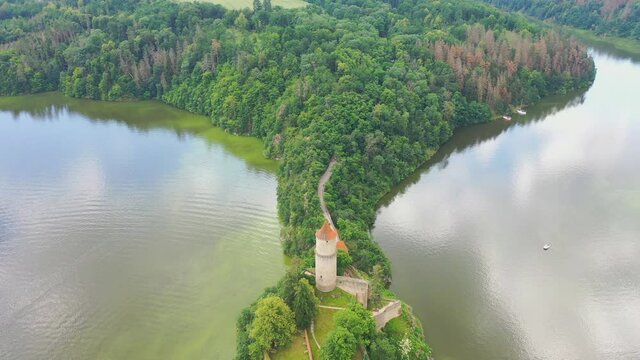 Aerial view on czech medieval castle Zvikov, situated on rocky outcrop above the confluence of two rivers Vltava and Otava, Czech republic