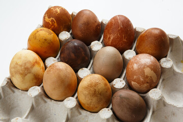 box of twelve original, unique colorful dragon or dinosaur looking like chicken Easter eggs, dyed with natural products (red wine, tea, coffee, carrots, turmeric, soy sauce)