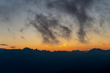 Fototapeta premium Silhouette mountains against sky at sunset