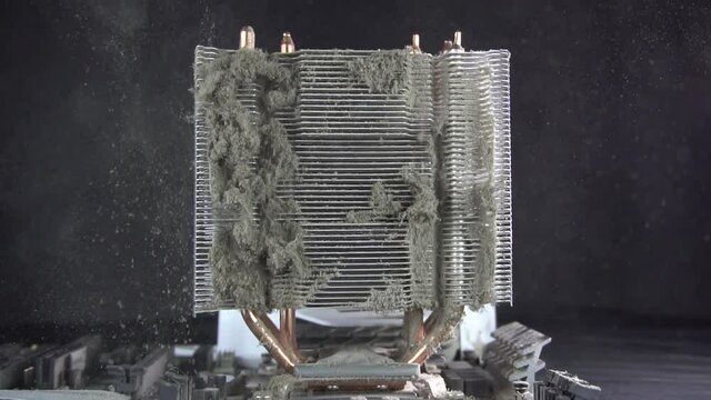 Dust pollution. Cleaning the processor radiator sink from dust. Antistatic brush. Slow motion.