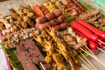 An assortment of raw and exotic Filipino street food ready to be cooked.