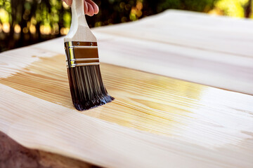 glazing of a wooden table with a hair brush and oil - obrazy, fototapety, plakaty