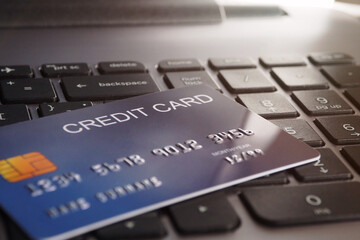 Credit cards on keyboard laptop for online shopping and financial concept