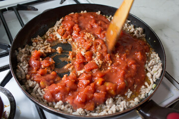 Preparation of lasagne.