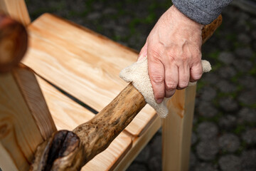 a rustic wooden chair will be glazed with oil