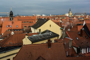 View of traditional houses with typical red tiled rooftops in Bamberg, Bavaria, Franconia, Germany....