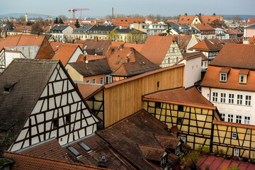 View of traditional houses with typical red tiled rooftops in Bamberg, Bavaria, Franconia, Germany....