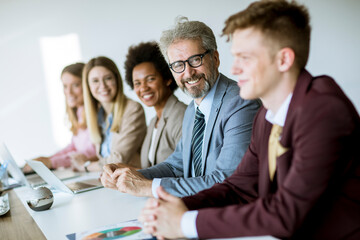 Group of young multiethnic business people working on new project