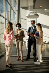 Group of asian business people meeting and working in office and wear mask for protect prevent infection by corona virus