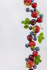 Fresh juicy berries and fruits on a white background, isolated, close-up, top view