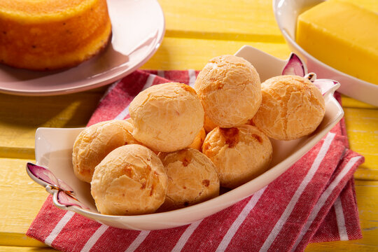 Brazilian cheese buns . Table coffee in the morning with cheese bread in basket.